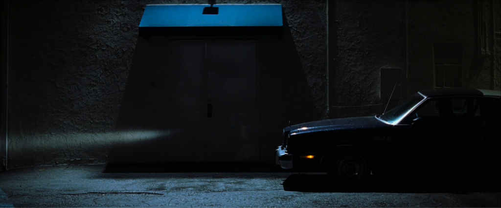 A dark car moving through the night